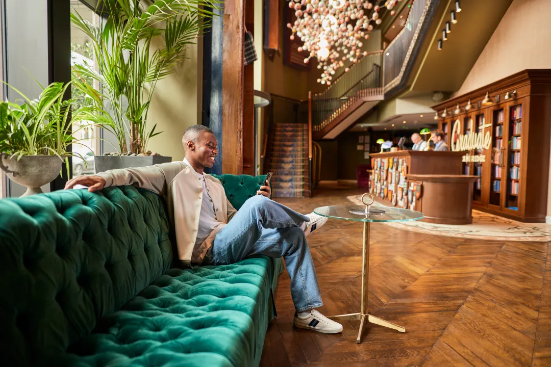 Artist relaxing in the lounge of an elegant hotel