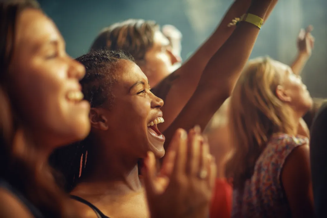 Fans cheering at a live music performance